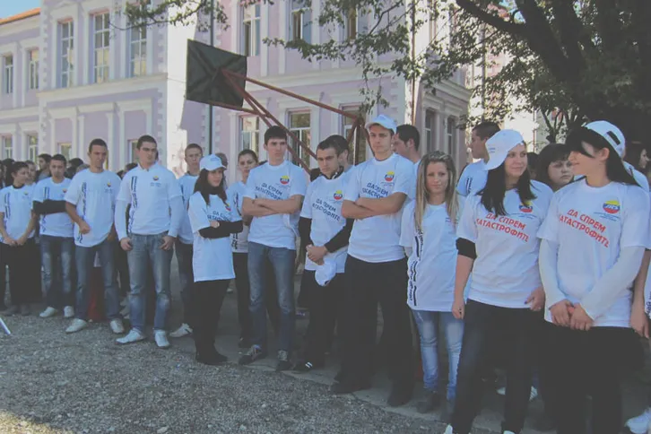 Students gathered in a school courtyard for a road safety awareness campaign