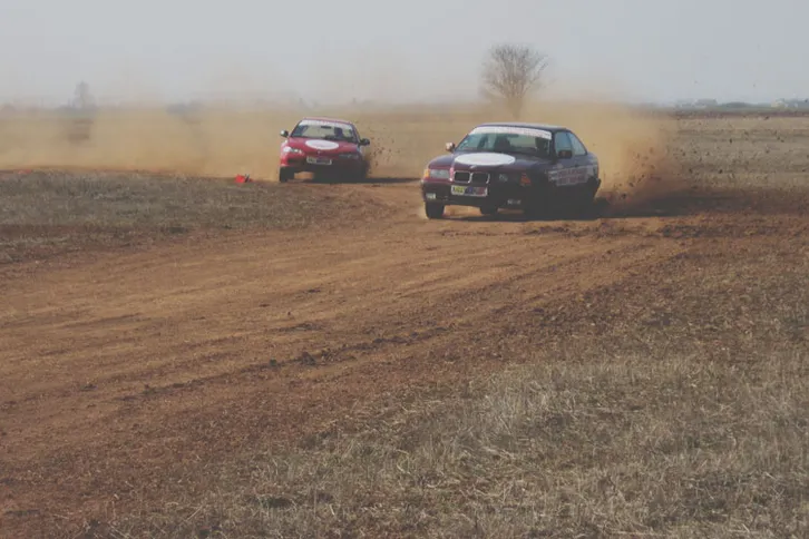 Race between our BMW and Honda cars on the rally track
