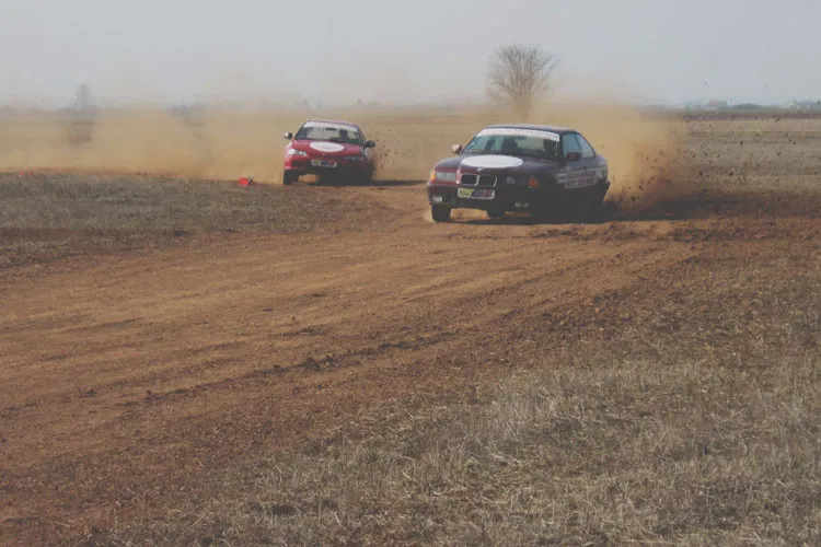 BMW and Honda racing side by side on our rally track