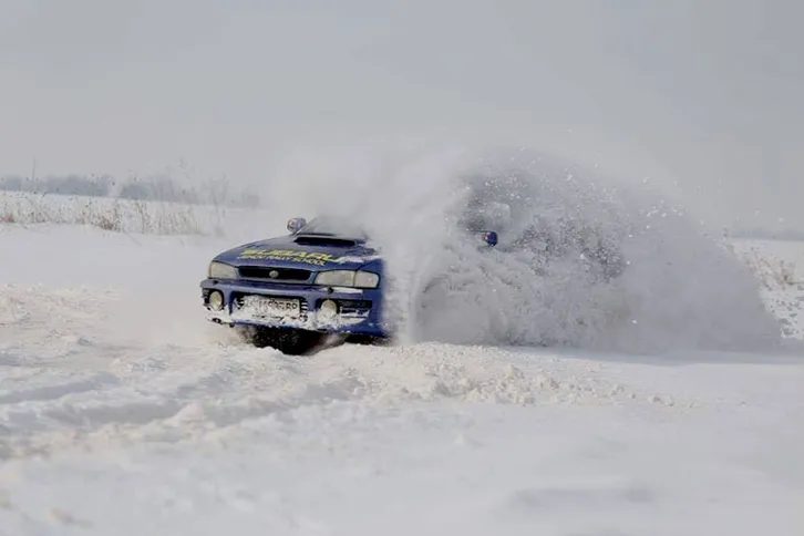 Subaru Impreza winter rally driving in the snow