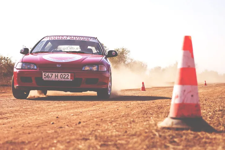 Our Honda sports car navigating the cone course on the track
