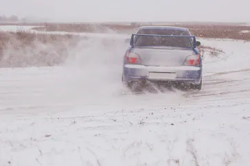 Subaru Impreza winter rally driving in the snow