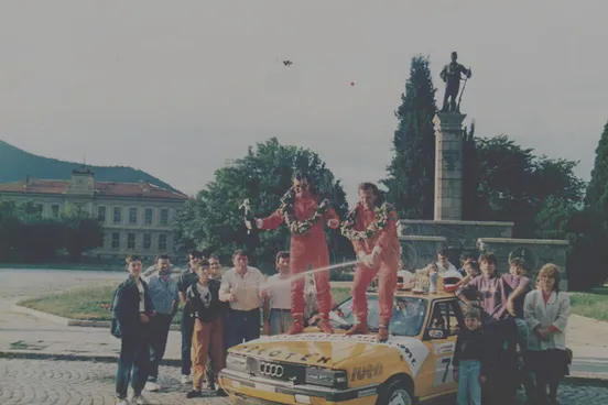 Celebrating a first-place finish at a rally race in Bulgaria