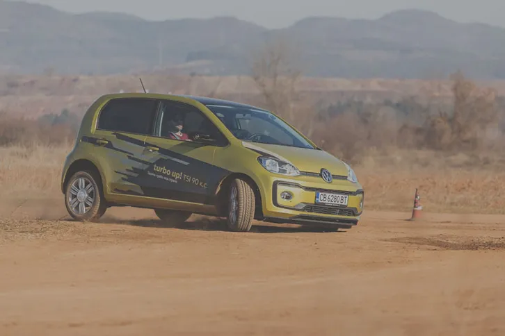 Volkswagen UP cornering on our safe driving track