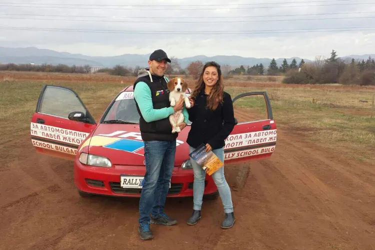 Marina, Vasko and Rufi at the rally track in front of the Honda