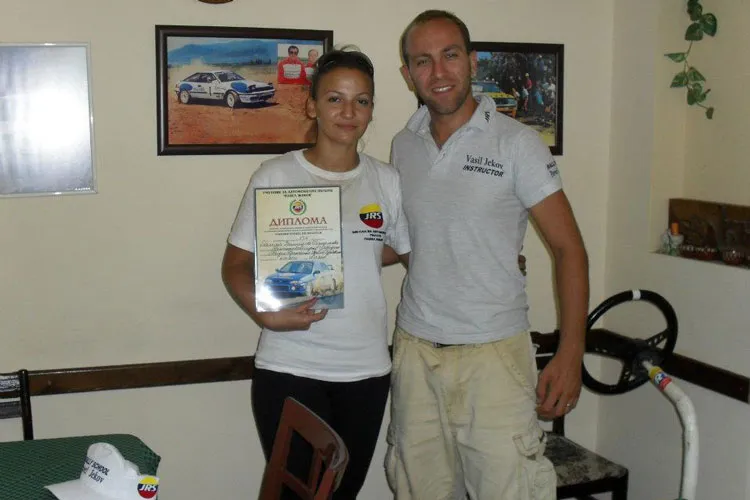 Vasil Jekov and Galina receiving a certificate after completing the safe driving course